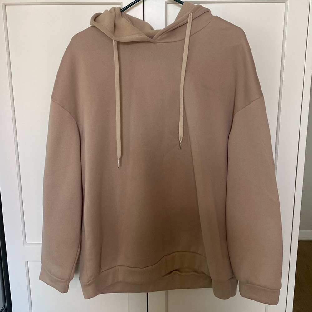 Tan sweatshirt never worn.